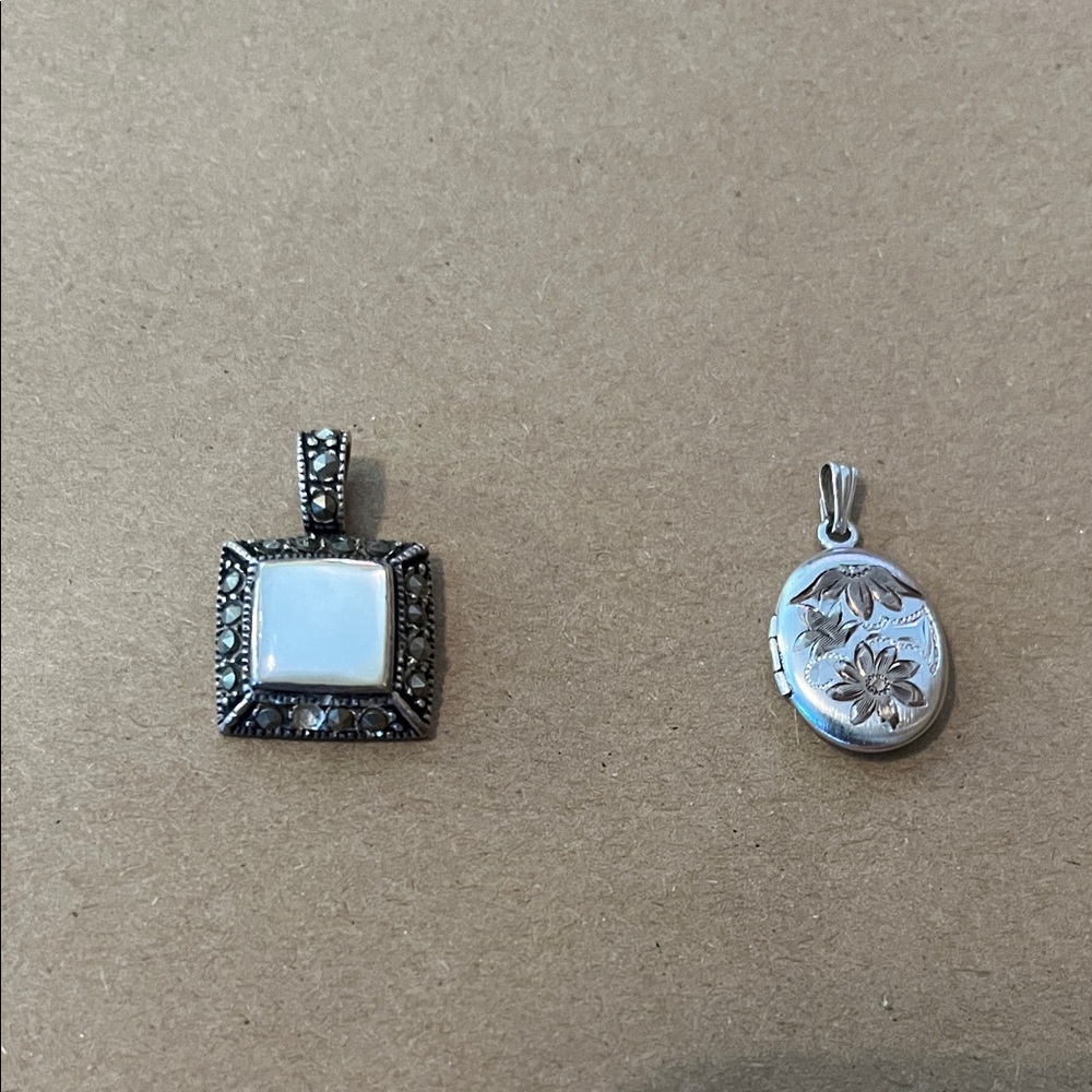 Set of two sterling silver pendants AS IS